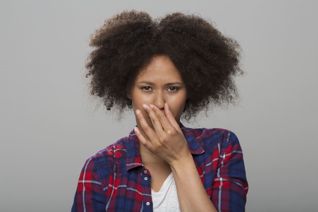 Young Woman Holding Nose