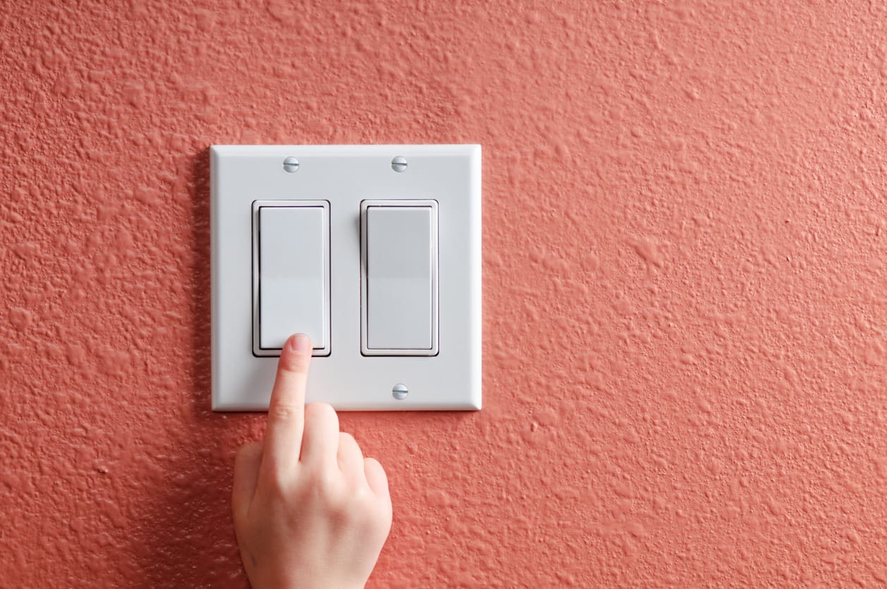 Light Switch on Red Wall