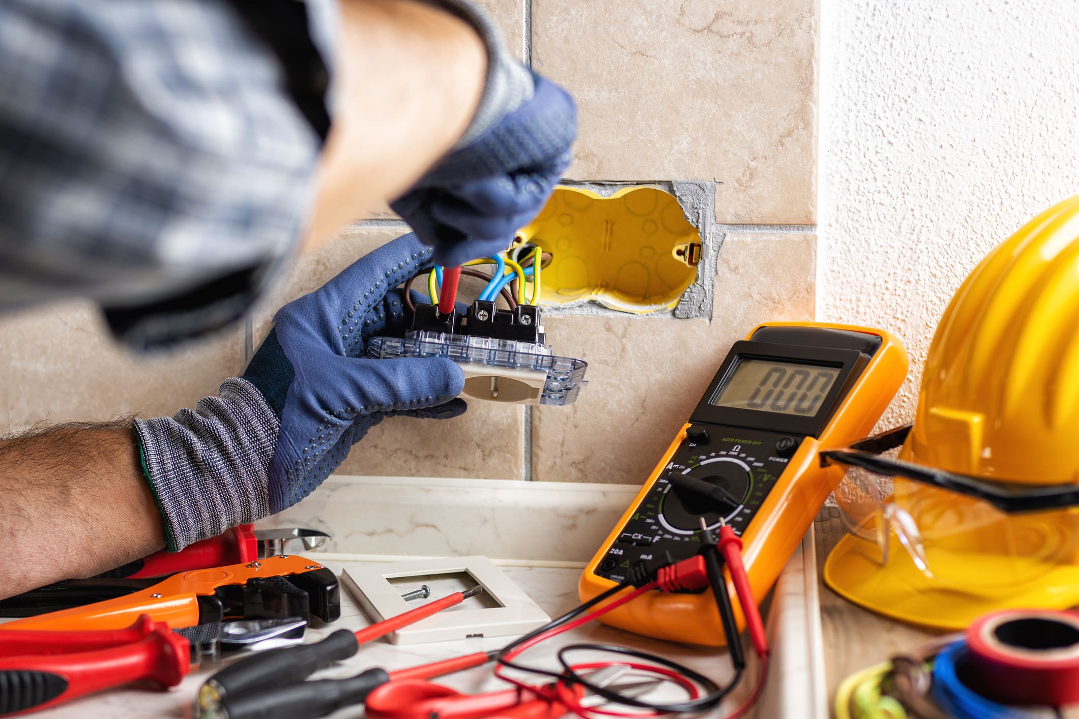 Electrician Working on Outlet